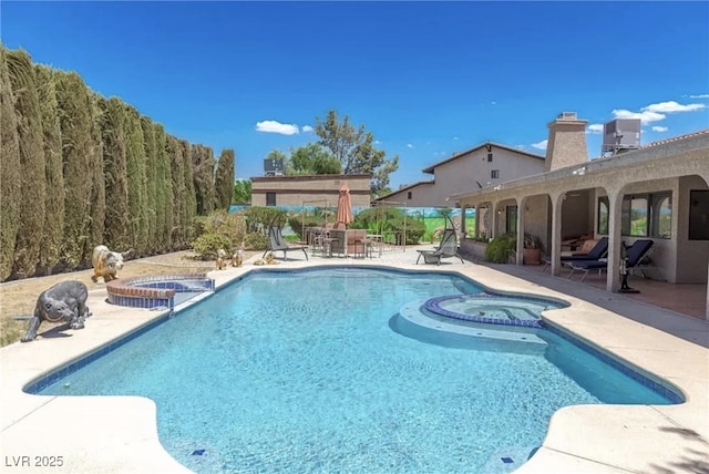 3430 Tanto Cir, Las Vegas, NV 89121 - view of swimming pool with a pool with connected hot tub and a patio
