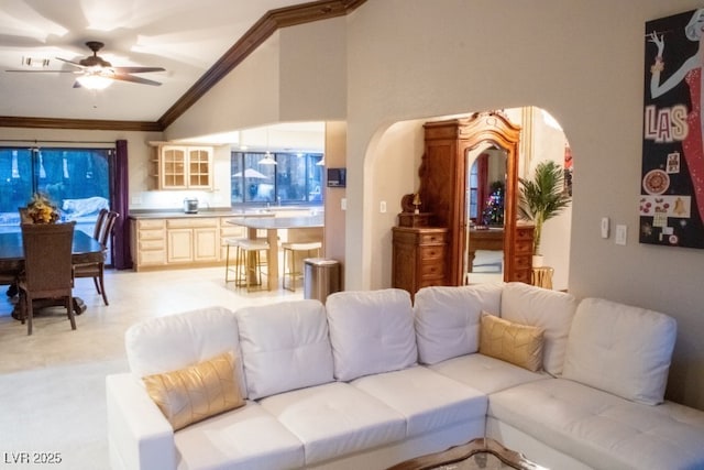 3430 Tanto Cir, Las Vegas, NV 89121 - living area with arched walkways, ceiling fan, high vaulted ceiling, and ornamental molding