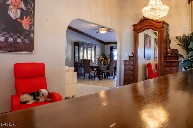 3430 Tanto Cir, Las Vegas, NV 89121 - dining area with arched walkways, ornamental molding, a ceiling fan, vaulted ceiling, and a chandelier
