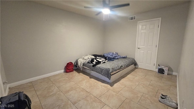 2941 Country Manor Ln Unit 27, Las Vegas, NV 89115 - bedroom with light tile patterned flooring and a ceiling fan