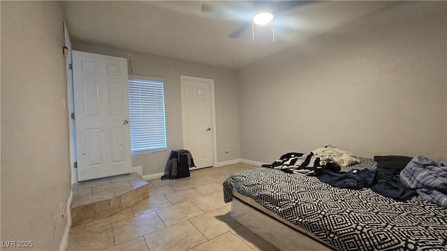 2941 Country Manor Ln Unit 27, Las Vegas, NV 89115 - bedroom featuring light tile patterned flooring and a ceiling fan