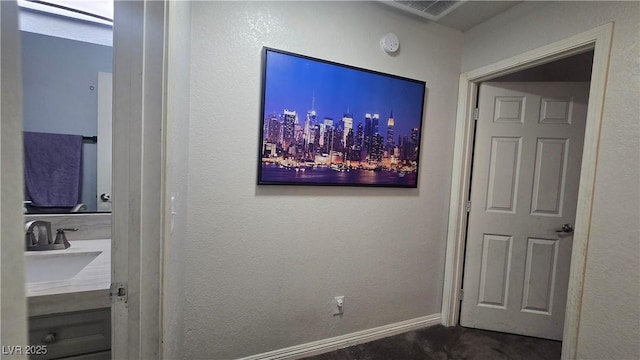 2941 Country Manor Ln Unit 27, Las Vegas, NV 89115 - hall featuring a sink and dark carpet