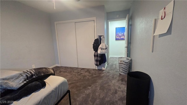 2941 Country Manor Ln Unit 27, Las Vegas, NV 89115 - carpeted bedroom with a closet and baseboards