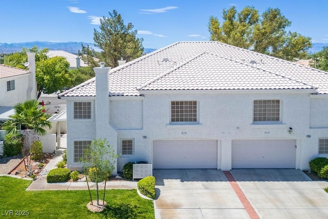 2902 Aztec Lily Ln, Henderson, NV 89074 - view of front of house with a tiled roof, a chimney, driveway, a garage, and stucco siding
