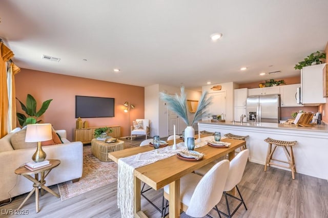 10988 Rollingford Ave Lot 10, Las Vegas, NV 89166 - dining space with light wood-type flooring and recessed lighting