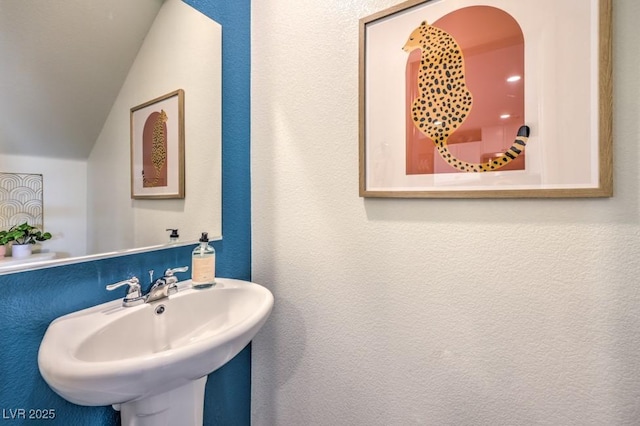 10988 Rollingford Ave Lot 10, Las Vegas, NV 89166 - bathroom featuring a sink and vaulted ceiling