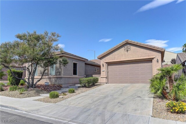 225 Palmetto Pointe Dr, Henderson, NV 89012 - ranch-style home with driveway, an attached garage, and stucco siding