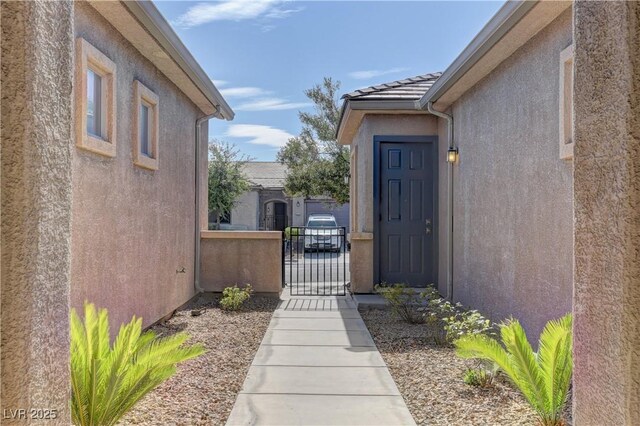 225 Palmetto Pointe Dr, Henderson, NV 89012 - property entrance with a gate and stucco siding