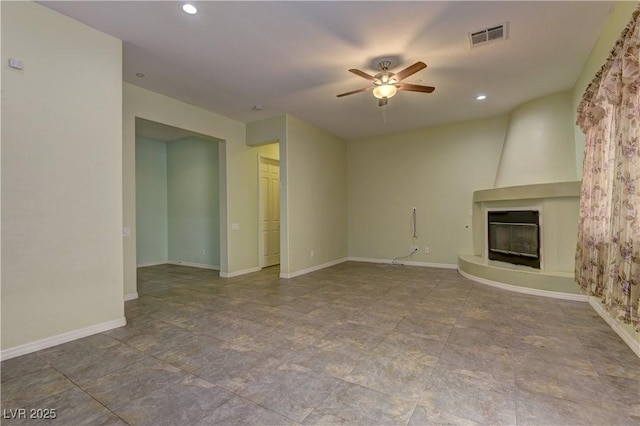 225 Palmetto Pointe Dr, Henderson, NV 89012 - unfurnished living room with a fireplace, a ceiling fan, and recessed lighting