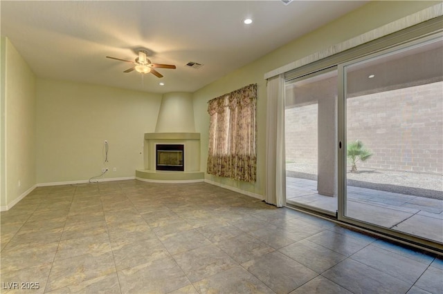 225 Palmetto Pointe Dr, Henderson, NV 89012 - unfurnished living room with a large fireplace, a ceiling fan, and recessed lighting