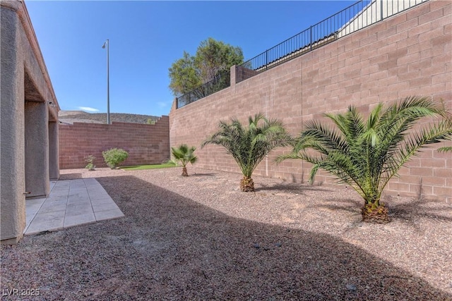225 Palmetto Pointe Dr, Henderson, NV 89012 - fenced backyard with a patio area