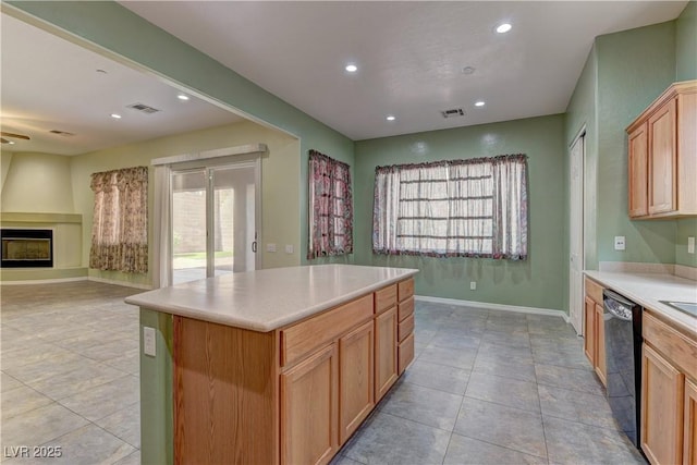 225 Palmetto Pointe Dr, Henderson, NV 89012 - kitchen with open floor plan, black dishwasher, recessed lighting, a fireplace, and light countertops