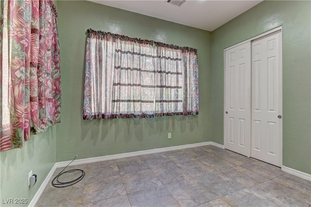 225 Palmetto Pointe Dr, Henderson, NV 89012 - unfurnished bedroom featuring a closet and baseboards