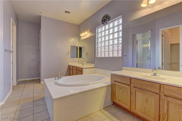 225 Palmetto Pointe Dr, Henderson, NV 89012 - bathroom with a bath, tile patterned floors, two vanities, and a shower stall