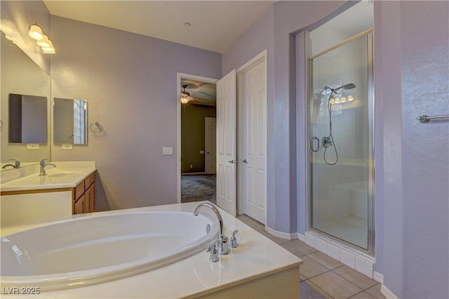 225 Palmetto Pointe Dr, Henderson, NV 89012 - bathroom with a stall shower, a garden tub, vanity, tile patterned floors, and ceiling fan