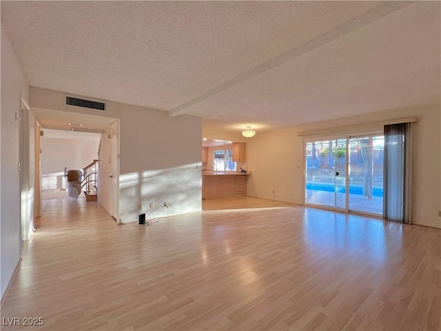 304 Broxton Ln, Las Vegas, NV 89107 - empty room with a textured ceiling and light wood finished floors