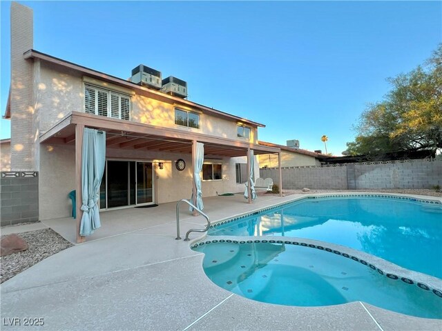 304 Broxton Ln, Las Vegas, NV 89107 - view of swimming pool featuring a pool with connected hot tub, a patio, and a fenced backyard