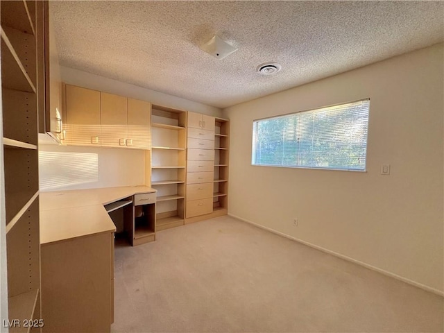 304 Broxton Ln, Las Vegas, NV 89107 - unfurnished office with light carpet, a textured ceiling, and built in study area