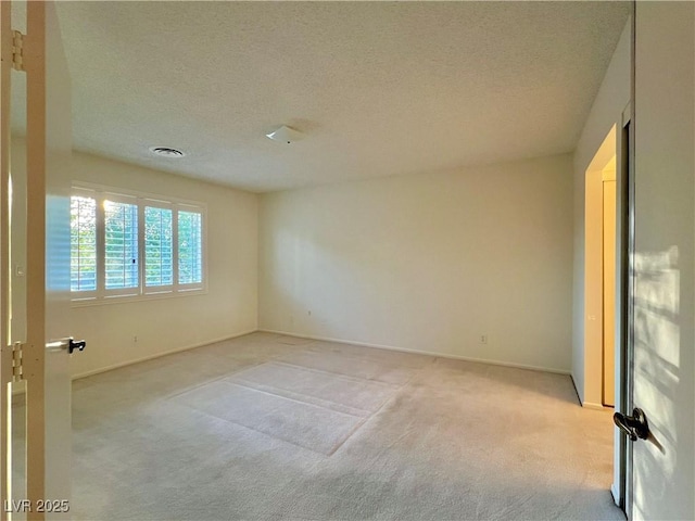 304 Broxton Ln, Las Vegas, NV 89107 - unfurnished room featuring light colored carpet and a textured ceiling