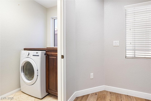 9432 Logan Ridge Ct, Las Vegas, NV 89139 - washroom featuring washer / dryer, cabinet space, and light wood-type flooring