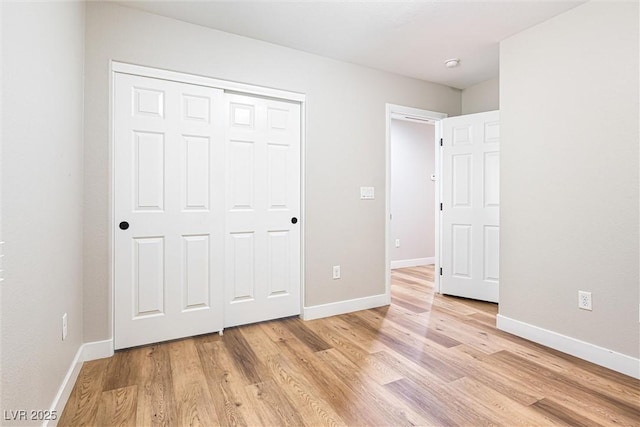 9432 Logan Ridge Ct, Las Vegas, NV 89139 - unfurnished bedroom featuring light wood-style floors and a closet