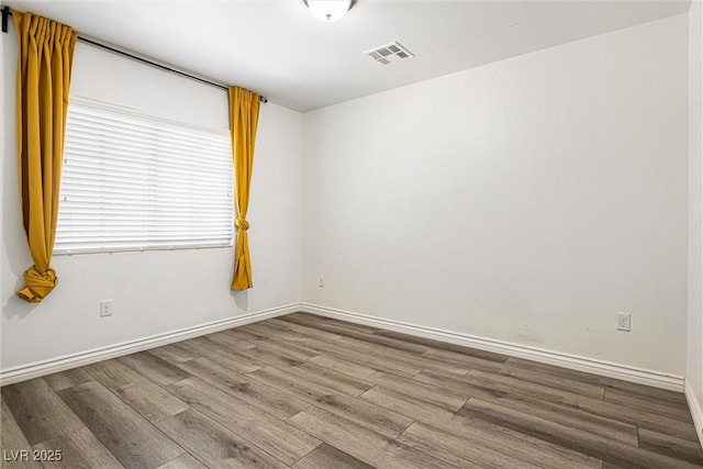 9432 Logan Ridge Ct, Las Vegas, NV 89139 - spare room featuring wood finished floors and baseboards