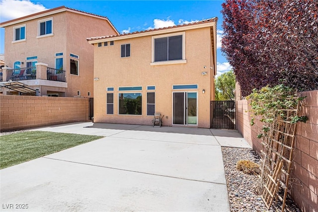 9432 Logan Ridge Ct, Las Vegas, NV 89139 - back of property featuring stucco siding, a fenced backyard, and a patio