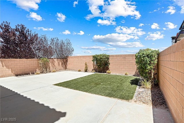 9432 Logan Ridge Ct, Las Vegas, NV 89139 - fenced backyard featuring a patio area
