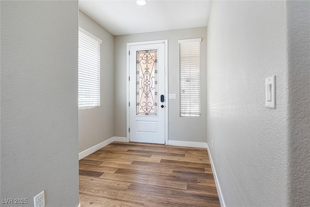 9432 Logan Ridge Ct, Las Vegas, NV 89139 - entryway featuring healthy amount of natural light, wood finished floors, and a textured wall
