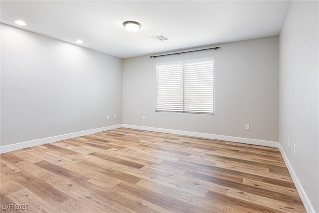 9432 Logan Ridge Ct, Las Vegas, NV 89139 - empty room with light wood-style flooring and recessed lighting
