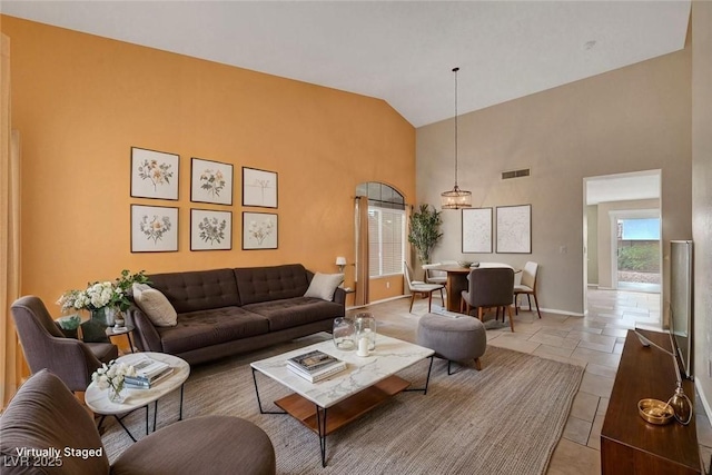 1424 Colt Dr, Henderson, NV 89002 - living area featuring high vaulted ceiling and baseboards