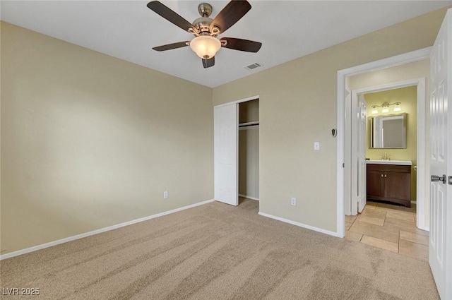 1424 Colt Dr, Henderson, NV 89002 - unfurnished bedroom featuring light colored carpet, a closet, and a ceiling fan