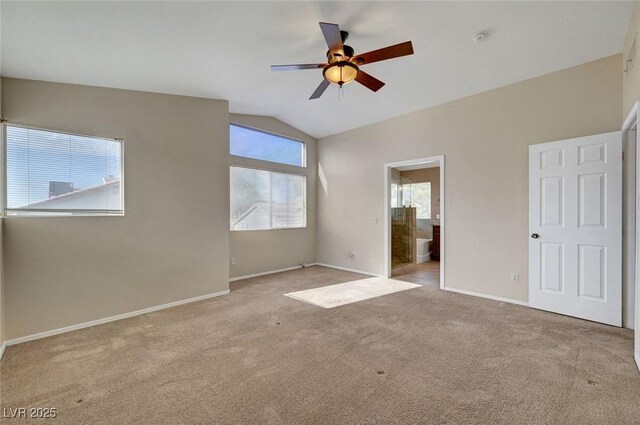 1424 Colt Dr, Henderson, NV 89002 - unfurnished bedroom featuring carpet, vaulted ceiling, connected bathroom, and a ceiling fan