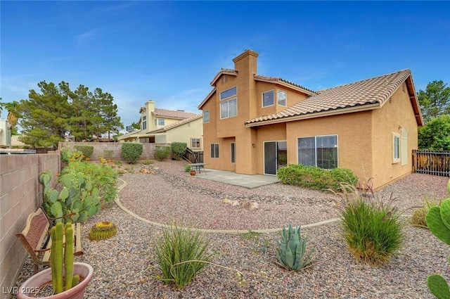 1424 Colt Dr, Henderson, NV 89002 - back of house with stucco siding, a patio area, a fenced backyard, and a tile roof