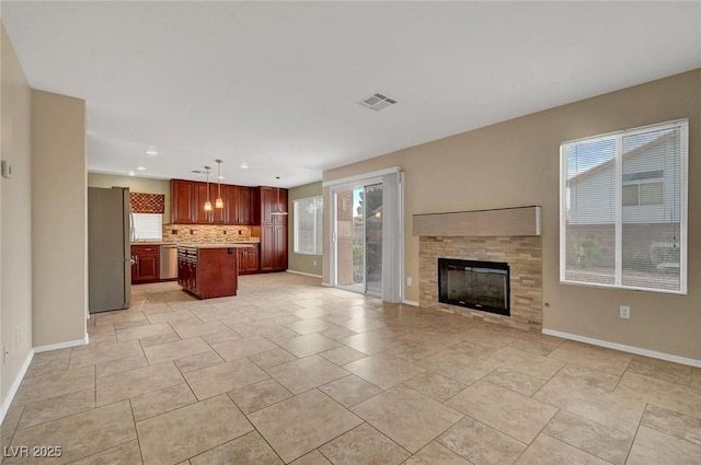 1424 Colt Dr, Henderson, NV 89002 - unfurnished living room featuring a tiled fireplace and recessed lighting