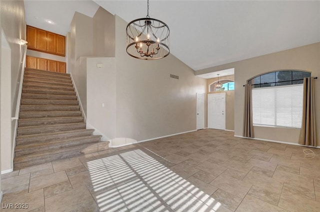 1424 Colt Dr, Henderson, NV 89002 - entryway with stone tile flooring, a chandelier, high vaulted ceiling, and stairway