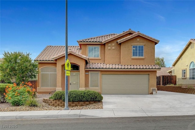 1424 Colt Dr, Henderson, NV 89002 - mediterranean / spanish-style house featuring stucco siding, concrete driveway, a garage, and a tiled roof