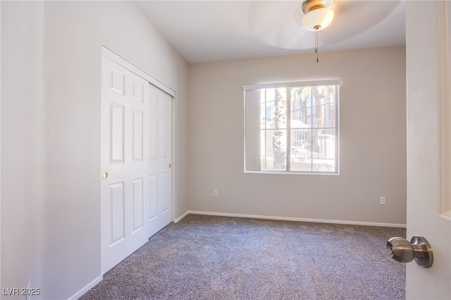 7167 Durango Dr Unit 111, Las Vegas, NV 89148 - unfurnished bedroom with carpet flooring, a ceiling fan, and a closet