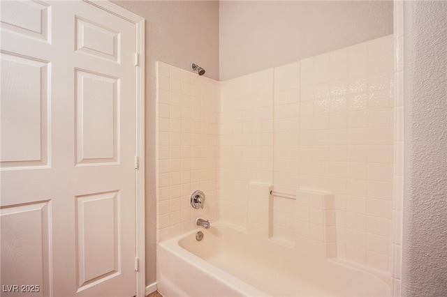 7167 Durango Dr Unit 111, Las Vegas, NV 89148 - bathroom featuring shower / washtub combination and a textured wall