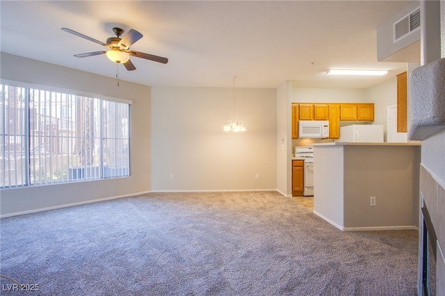 7167 Durango Dr Unit 111, Las Vegas, NV 89148 - unfurnished living room with a ceiling fan, light colored carpet, and a chandelier