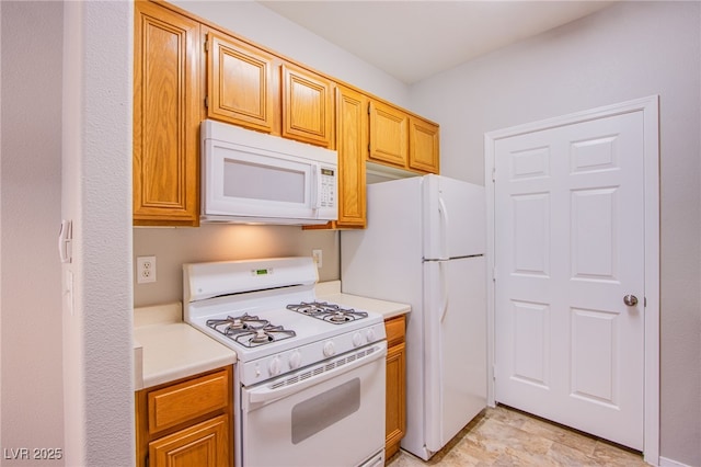 7167 Durango Dr Unit 111, Las Vegas, NV 89148 - kitchen with white appliances and light countertops
