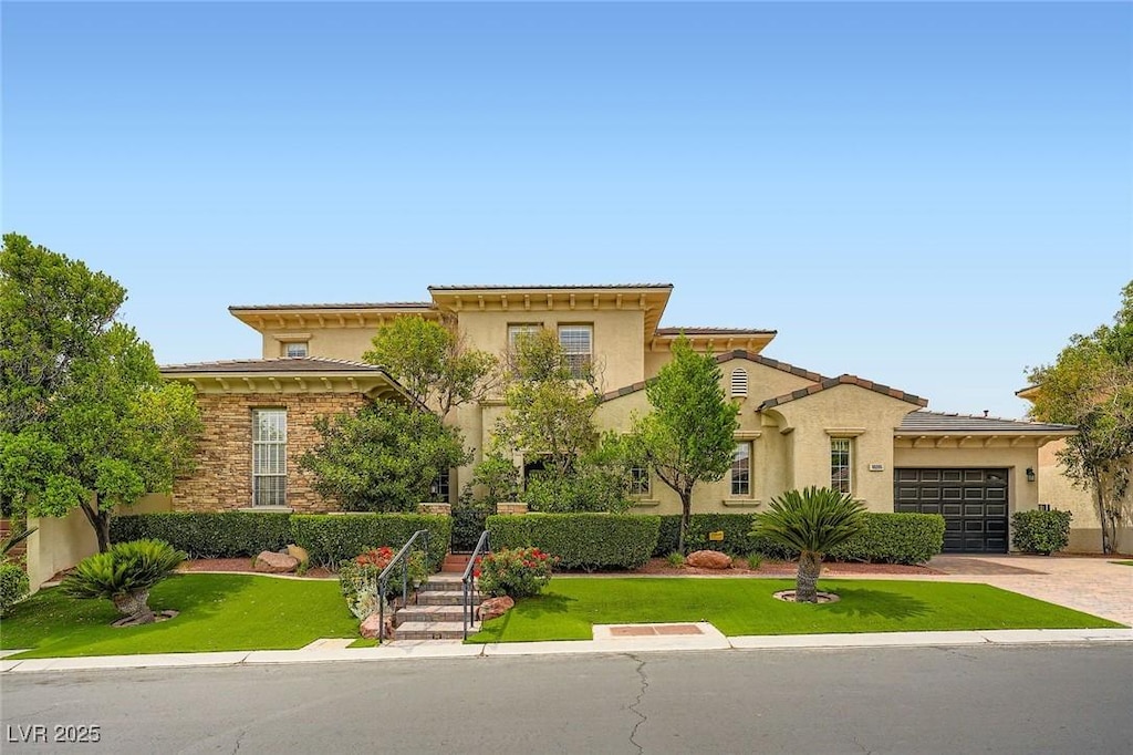 10205 Orkiney Dr, Las Vegas, NV 89144 - mediterranean / spanish-style home featuring a garage, driveway, stucco siding, and a front lawn