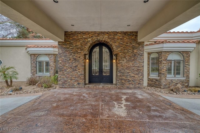 81 Quail Run Rd, Henderson, NV 89014 - entrance to property featuring french doors, stone siding, and stucco siding