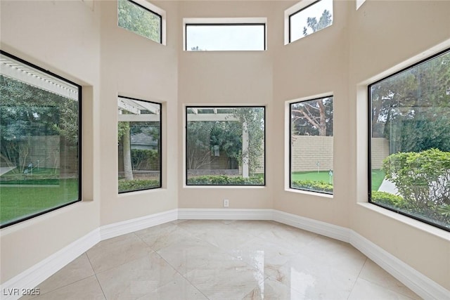 81 Quail Run Rd, Henderson, NV 89014 - unfurnished room featuring healthy amount of natural light and a high ceiling