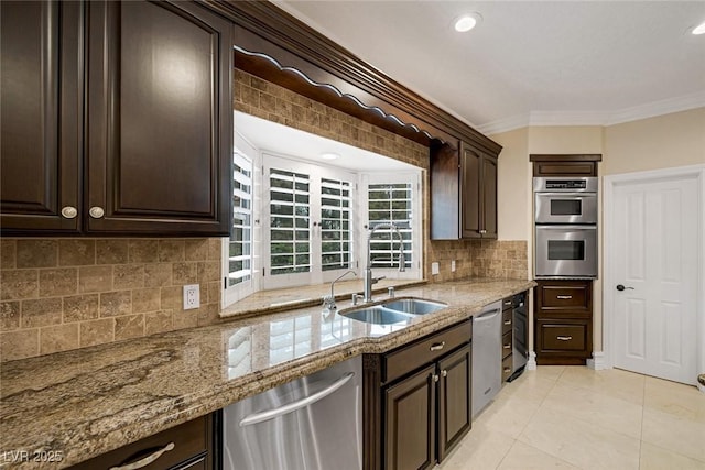 81 Quail Run Rd, Henderson, NV 89014 - kitchen with stainless steel appliances, crown molding, light stone counters, dark brown cabinets, and decorative backsplash