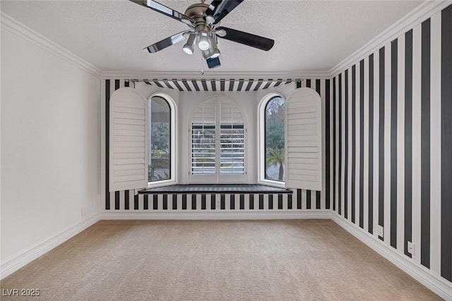 81 Quail Run Rd, Henderson, NV 89014 - empty room featuring crown molding, carpet floors, a textured ceiling, and a ceiling fan