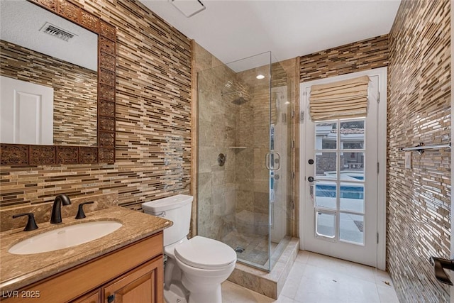 81 Quail Run Rd, Henderson, NV 89014 - full bathroom featuring vanity, a stall shower, tile patterned floors, tile walls, and tasteful backsplash