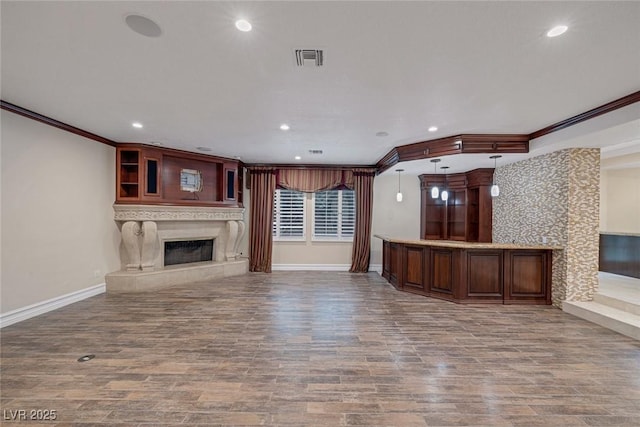 81 Quail Run Rd, Henderson, NV 89014 - unfurnished living room with a high end fireplace, crown molding, wood finished floors, and recessed lighting