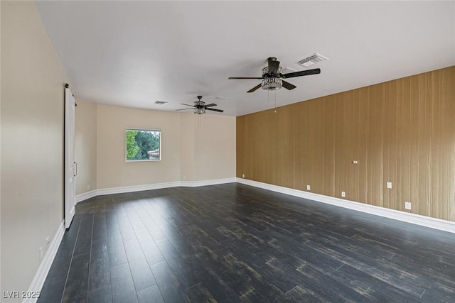 81 Quail Run Rd, Henderson, NV 89014 - empty room with dark wood-style flooring, ceiling fan, and wooden walls