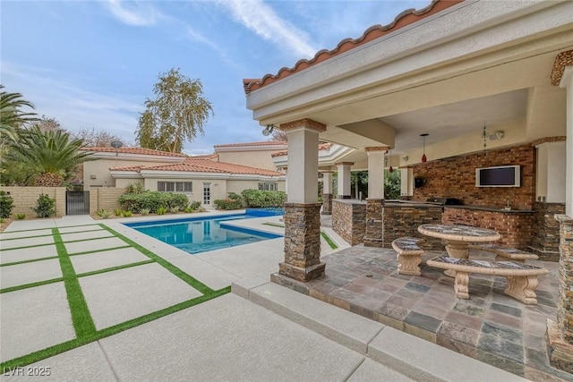 81 Quail Run Rd, Henderson, NV 89014 - view of swimming pool with a patio area and an outdoor kitchen